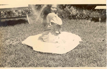 woman on grass wtih dress on